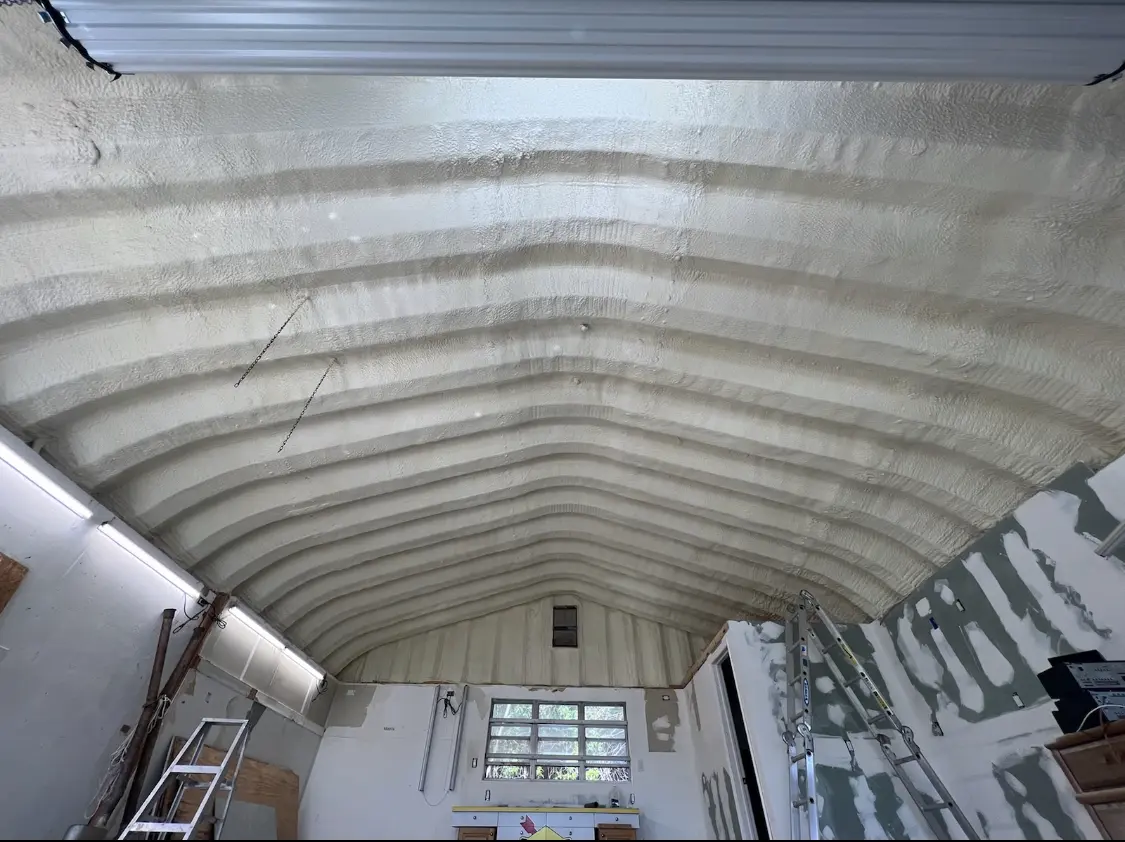 Spray polyurethane foam applied to the underside of a metal roof deck in Beaufort